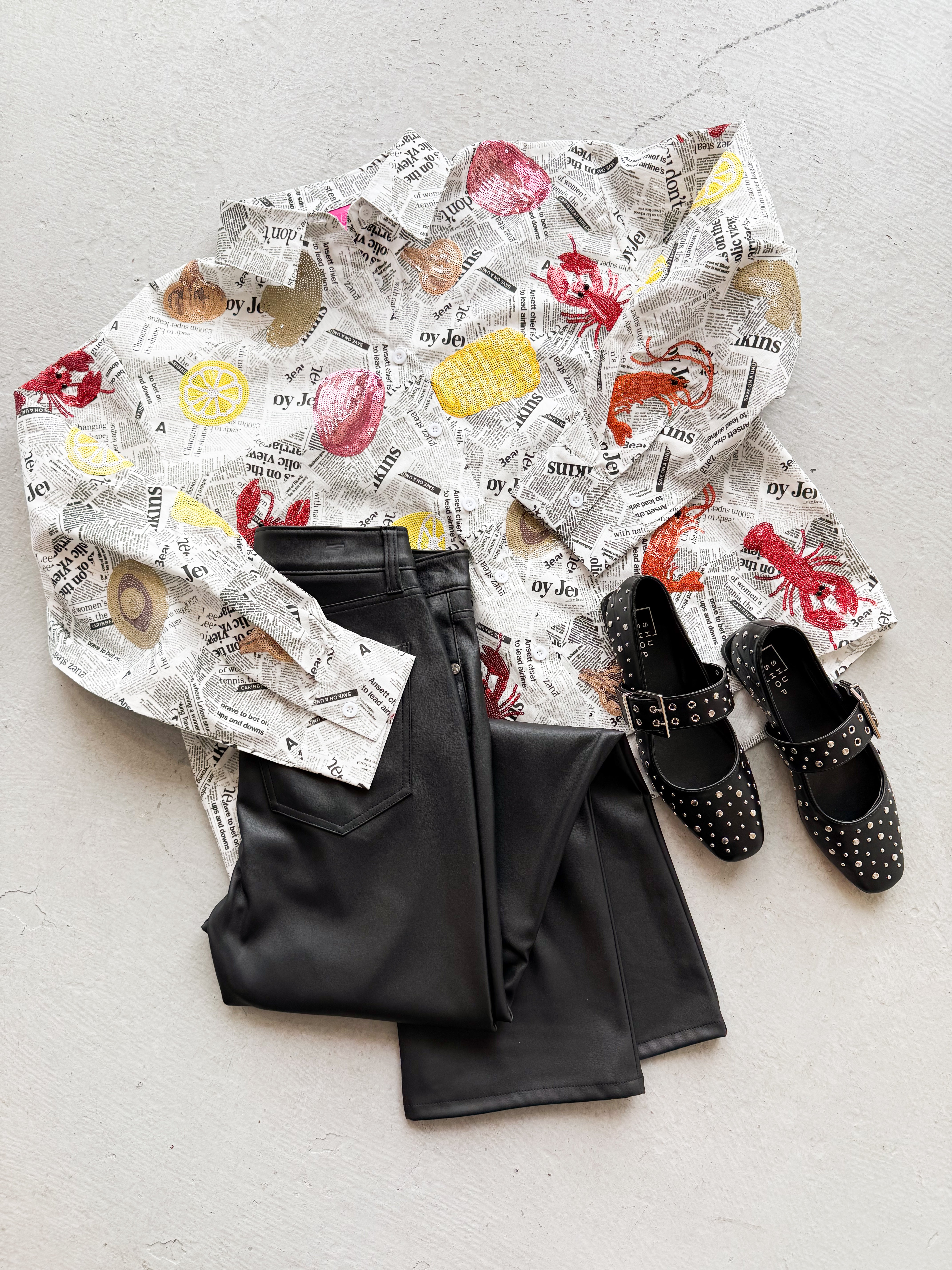 Queen of Sparkles Seafood Newspaper